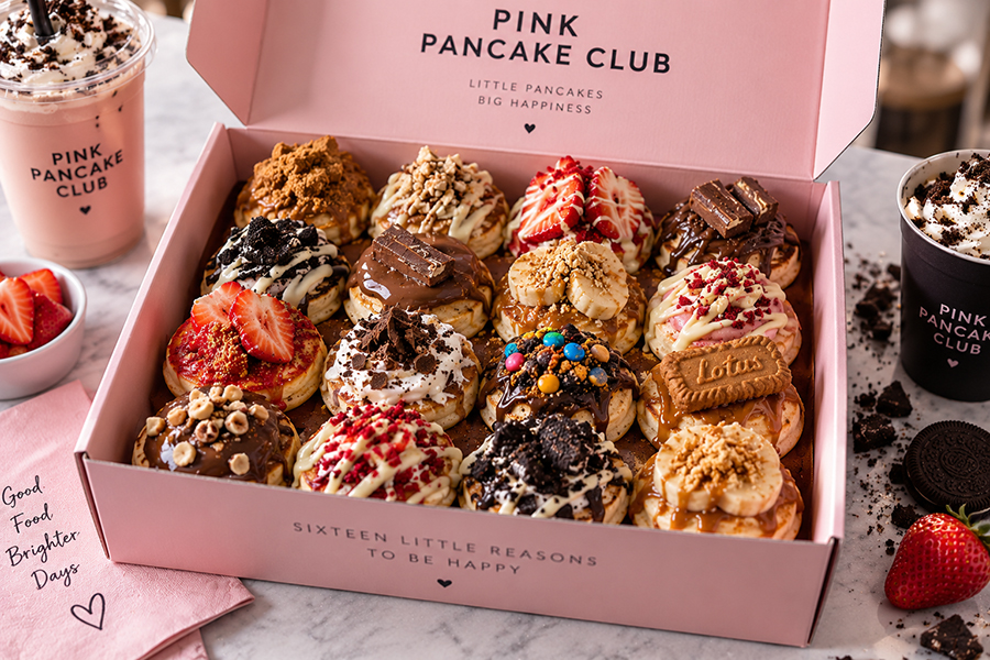 Pink Pancake Club mini pancake box with 16 mini pancakes covered in toppings